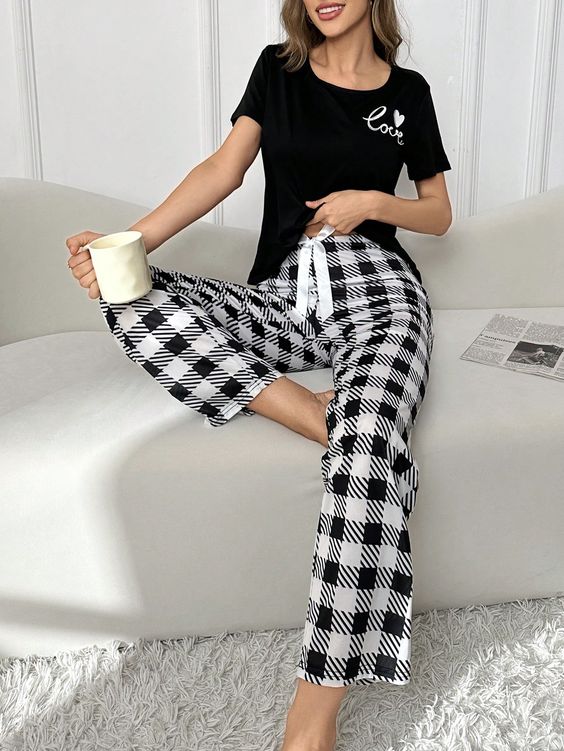 Elegant simplicity in Black and White Pajamas. Classic colors meet comfort for a timeless loungewear choice. Relax in style with these chic and cozy sleepwear pieces, perfect for any night.
